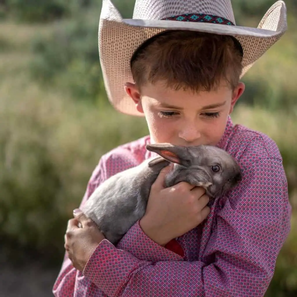 12 year old boy with pet bunny